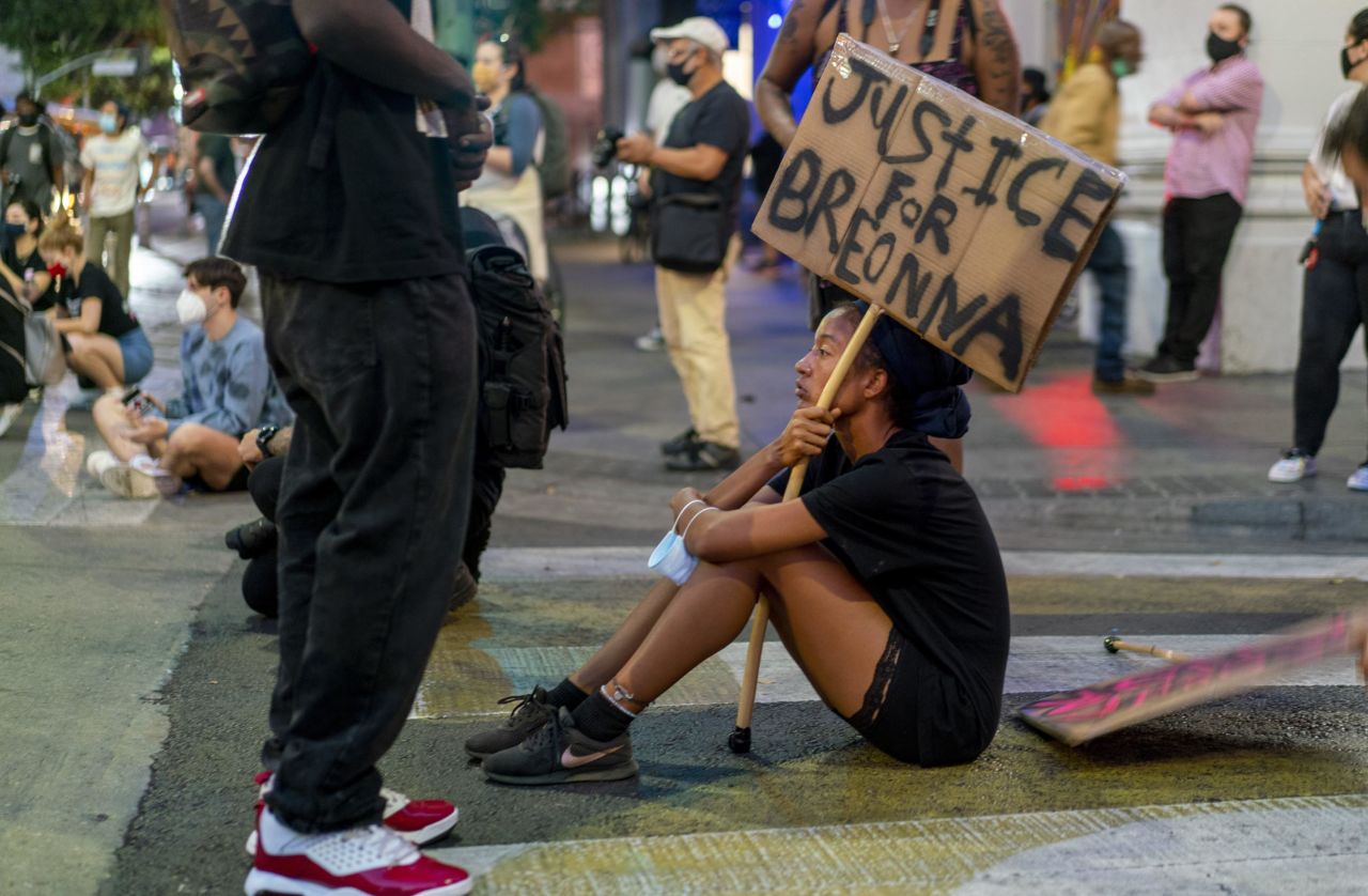 A protester rests in an intersection in downtown Los Angeles.