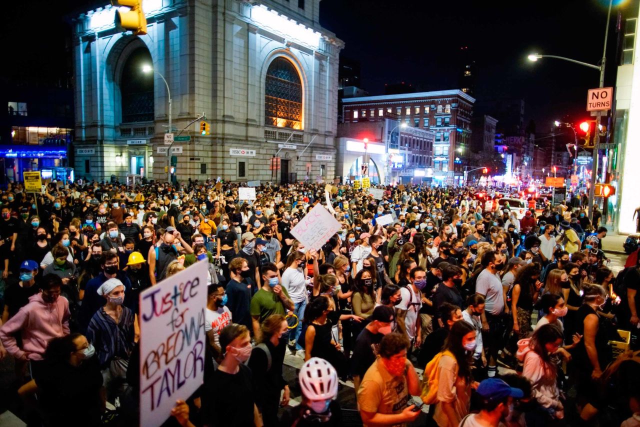 Demonstrators march during a protest in New York over a Kentucky grand jury's decision not to indict any police officers for the killing of Taylor.