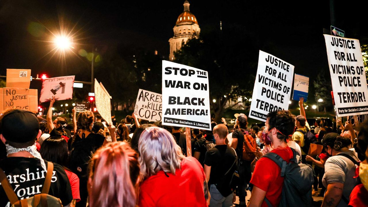 People protest the grand jury decision in the Breonna Taylor case outside the Colorado State Capitol in Denver on September 23, 2020.
