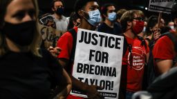 DENVER, CO - SEPTEMBER 23: A man holds a "Justice for Breonna Taylor" sign as people protest the grand jury decision in the Taylor case on September 23, 2020 in Denver, United States. The death of Taylor, who was shot and killed by officers executing a search warrant in Louisville, has sparked protests across the country. The grand jury decision indicted one former Louisville police detective on three counts of wanton endangerment, but no officer was directly charged in connection to Taylor's death. (Photo by Michael Ciaglo/Getty Images)