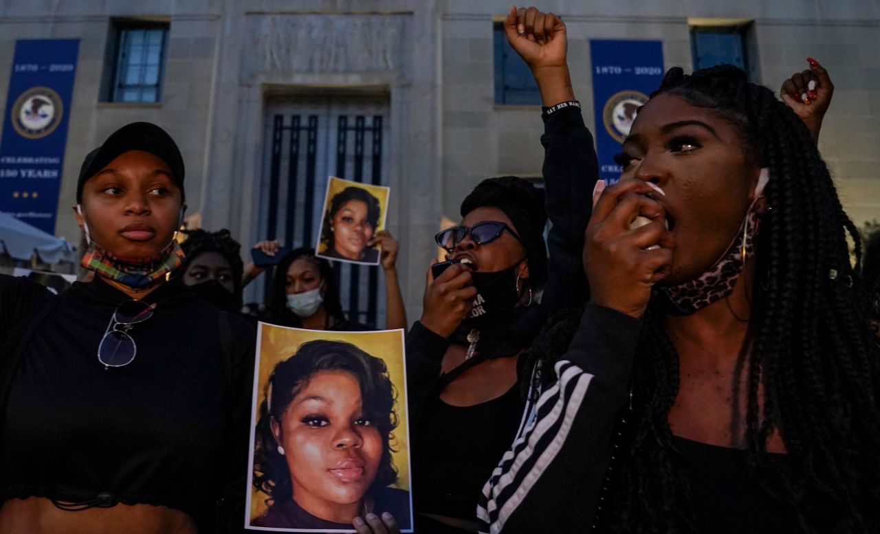 Demonstrators gather at the US Department of Justice before marching to the White House to call for justice for Taylor.