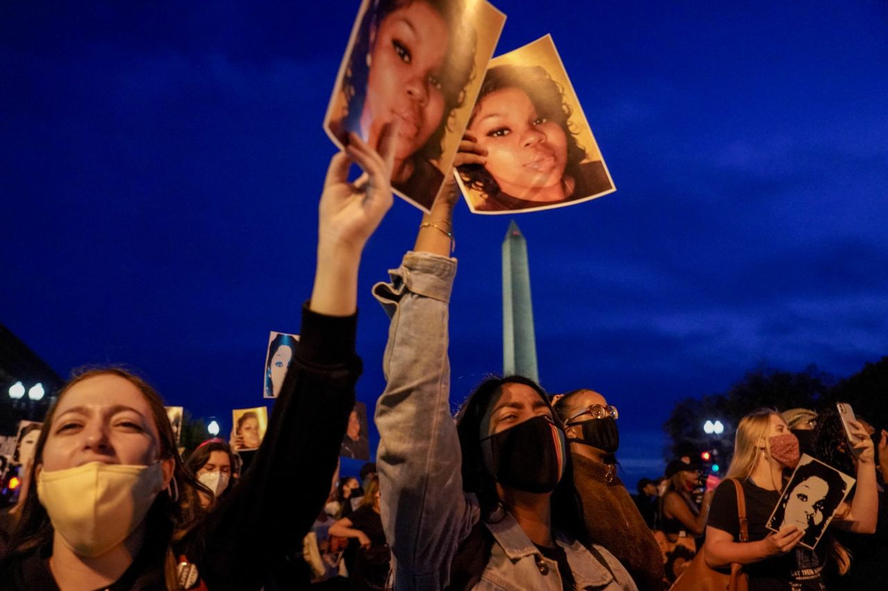 Demonstrators march from the US Department of Justice to the White House.