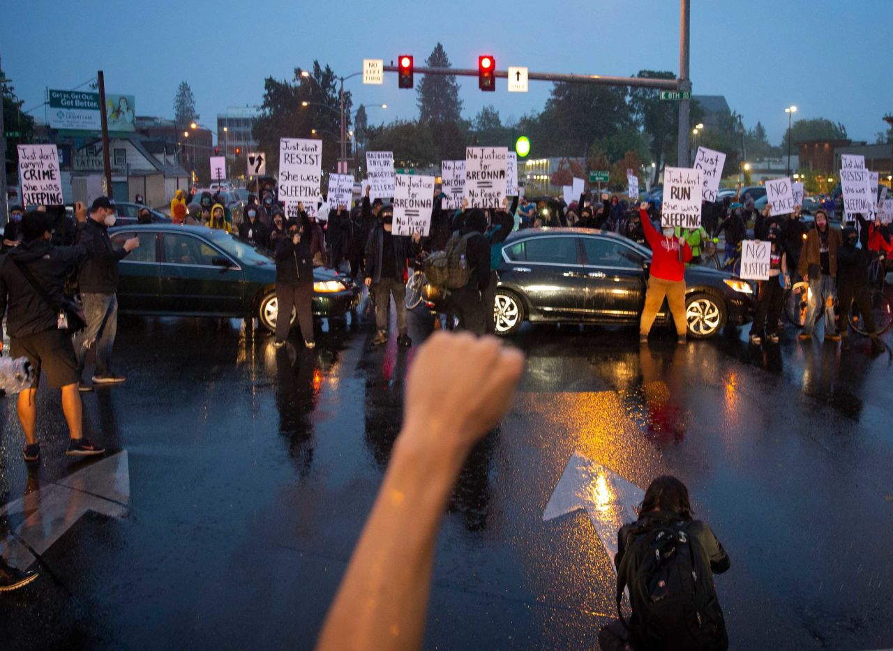 Demonstrators march and block streets in Eugene, Oregon.