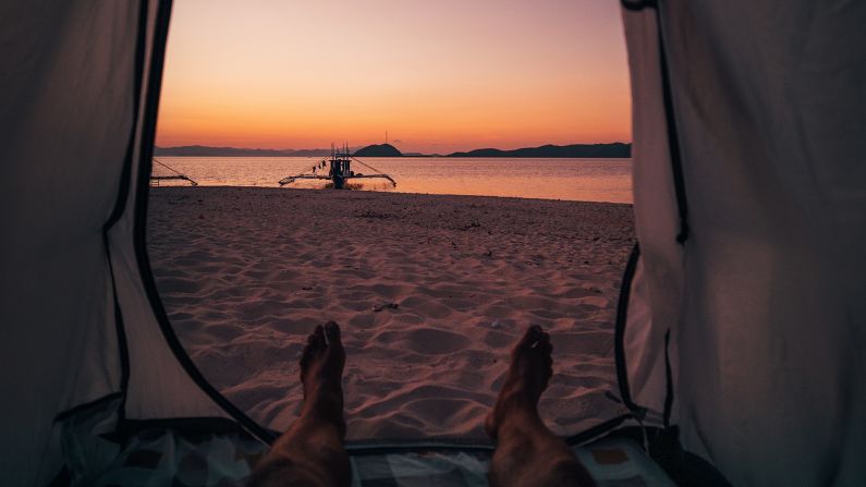 <strong>Beach camping: </strong>In the evenings, travelers stay in bamboo beach cottages or set up tents and camp in the sand on a remote island, where they often have a bonfire, share some stories, stargaze then fall asleep to the rhythm of the sea.