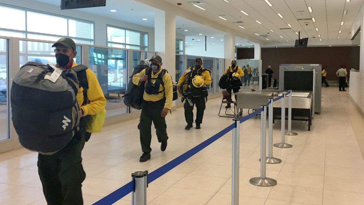 Mexican firefighters arrive in California on Wednesday.