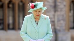 WINDSOR, ENGLAND - JULY 17: Queen Elizabeth II poses after awarding Captain Sir Thomas Moore with the insignia of Knight Bachelor at Windsor Castle on July 17, 2020 in Windsor, England. British World War II veteran Captain Tom Moore raised over £32 million for the NHS during the coronavirus pandemic.  (Photo by Chris Jackson/Getty Images)