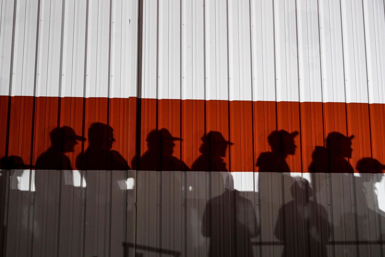 Shadows are cast on a wall during Trump's campaign rally at the Toledo Express Airport in Swanton, Ohio.