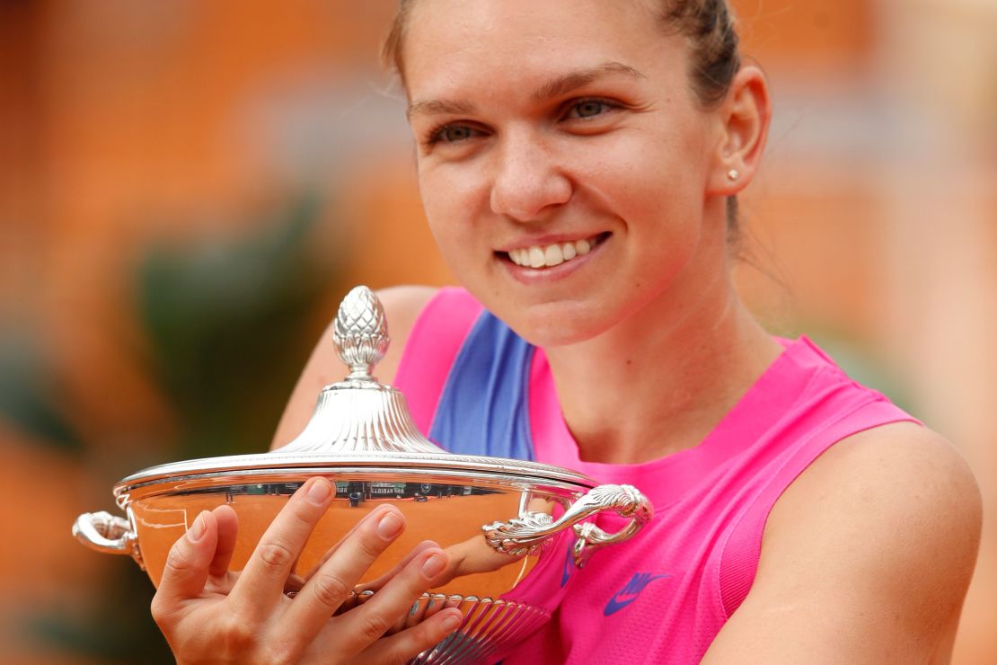 Halep poses with her trophy after winning Italian Open.