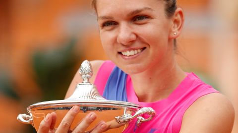 Halep poses with her trophy after winning Italian Open.