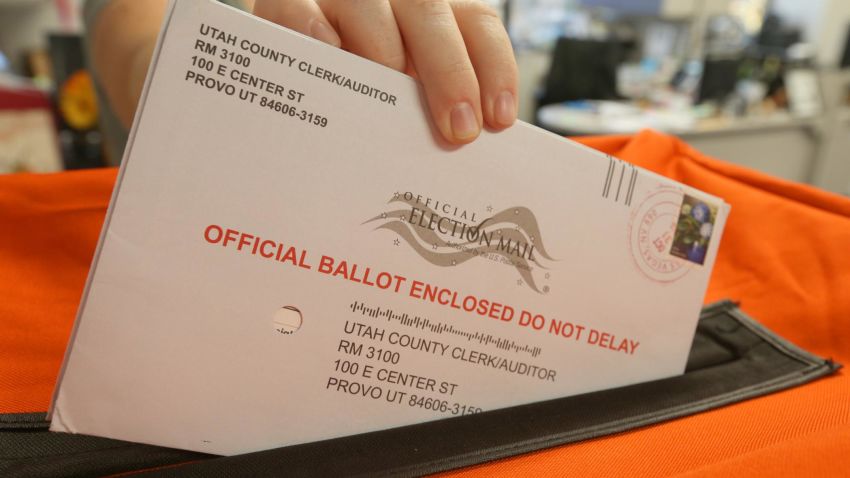 An employee at the Utah County Election office handles mail in ballots in the midterm elections on November 6, 2018 in Provo, Utah. (Photo by George Frey/Getty Images)