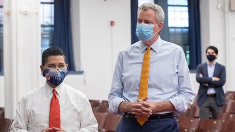 Richard Carranza, chancellor of the New York City Department of Education, and Bill de Blasio, mayor of New York, attend a news conference at an elementary school in Brooklyn on Aug. 19, 2020.