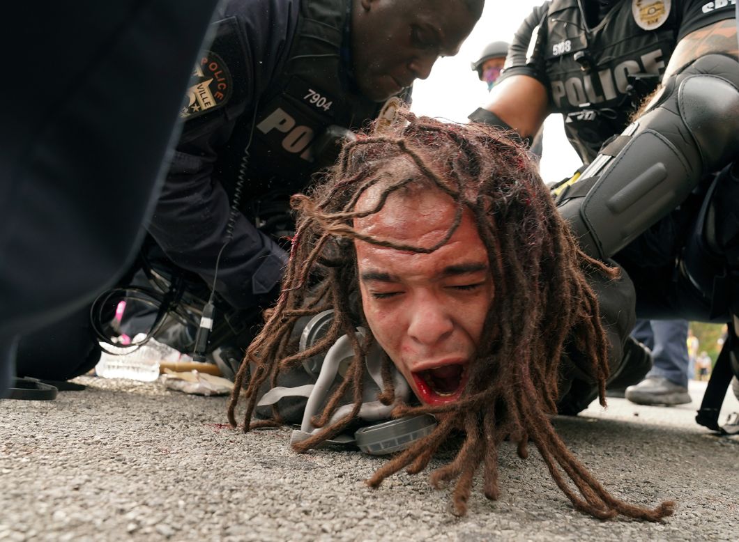 Police officers detain a man during a protest in Louisville, Kentucky, following the grand jury indictment in the Breonna Taylor case on Wednesday, September 23. The grand jury charged former Louisville police officer Brett Hankison with first-degree wanton endangerment charges for his alleged actions on the night Taylor was killed by police. Two other officers at the scene were not indicted, and none were charged directly with her death. <a href="https://www.cnn.com/2020/09/23/us/gallery/breonna-taylor-protests/index.html" target="_blank">See photos from the demonstrations in cities across the US.</a>