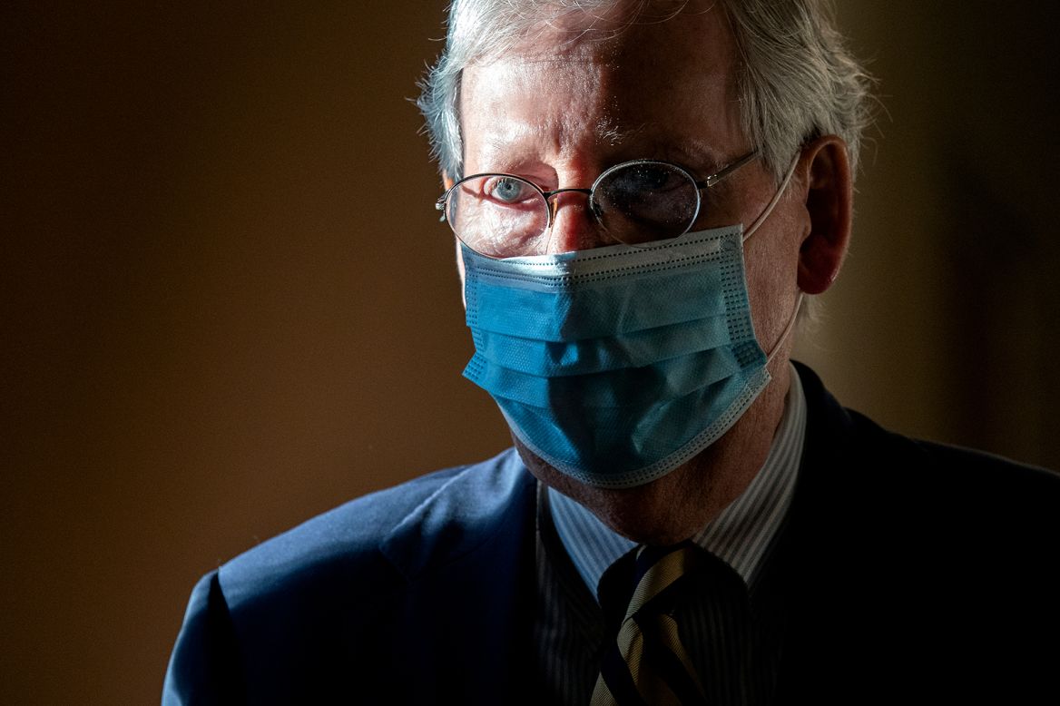Senate Majority Leader Mitch McConnell wears a protective mask as he walks to his office following a roll call vote at the Capitol on Monday, September 21. McConnell plans to hold a vote on <a href="https://www.cnn.com/2020/09/21/politics/donald-trump-supreme-court-pick/index.html" target="_blank">President Donald Trump's nomination</a> to the Supreme Court this year following the death of Justice Ruth Bader Ginsburg. 