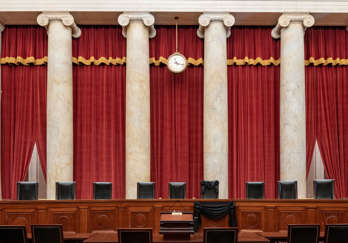 In this photo released by the Collection of the Supreme Court of the United States on Sunday, September 20, Justice Ruth Bader Ginsburg's bench chair is draped with black wool crepe.
