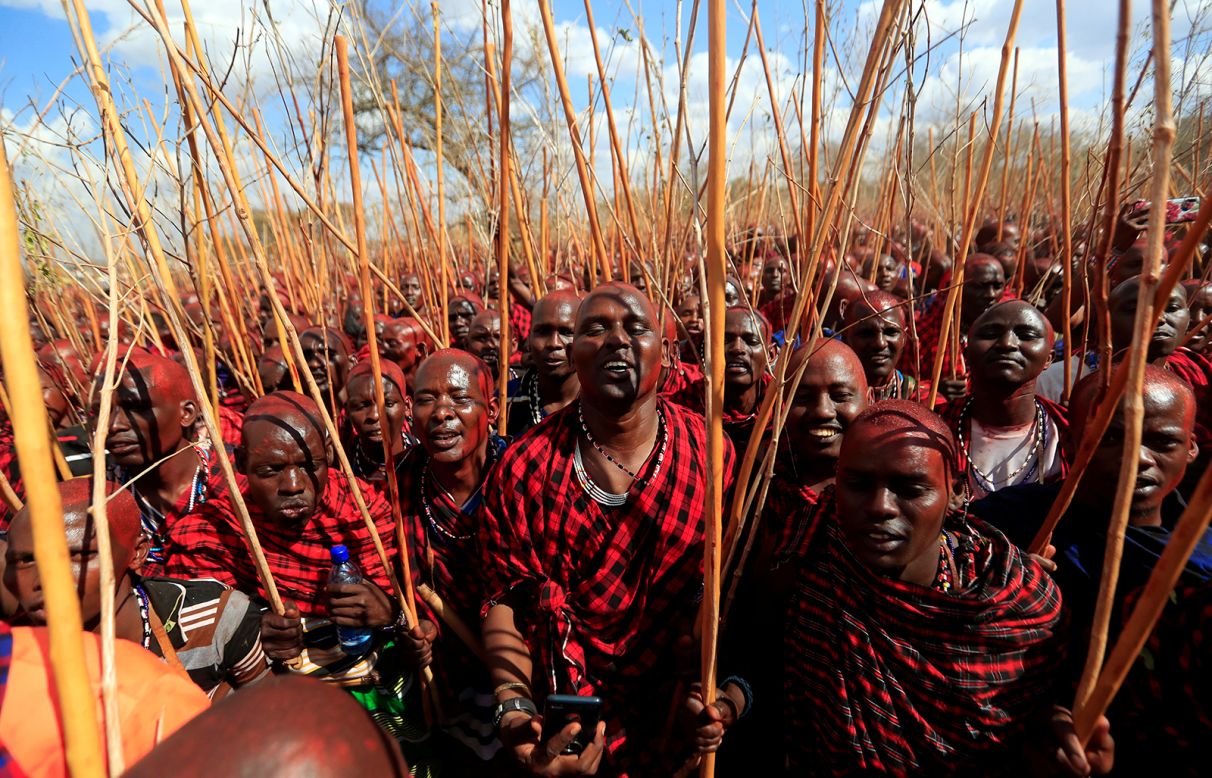 Maasai men of the sub-tribe Matapato attend the Olngesherr passage ceremony, an initiation that marks the status of a junior elder, on Wednesday, September 23, in the Maparasha hills of Kajiado, Kenya. The final rite of passage was initially postponed to curb the spread of the coronavirus.