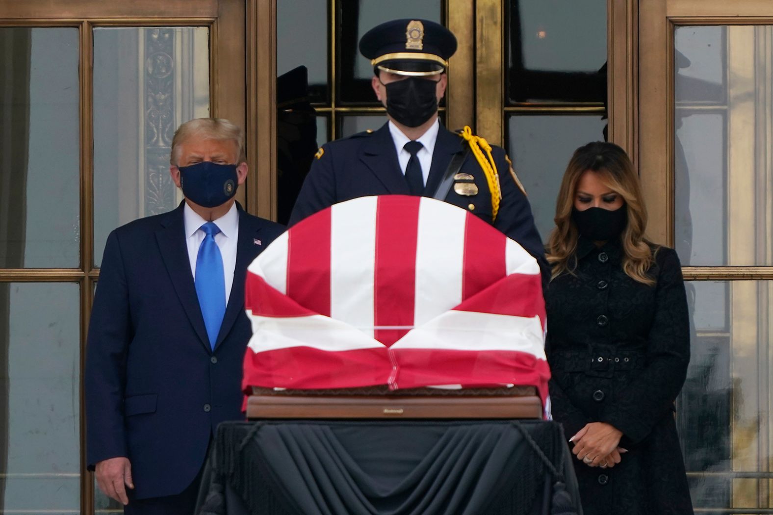 Trump and the first lady pay respects to Supreme Court Justice Ruth Bader Ginsburg in September 2020. <a href="index.php?page=&url=https%3A%2F%2Fwww.cnn.com%2F2020%2F09%2F24%2Fpolitics%2Fdonald-trump-supreme-court-boos%2Findex.html" target="_blank">The president was booed</a> as he appeared near the coffin.