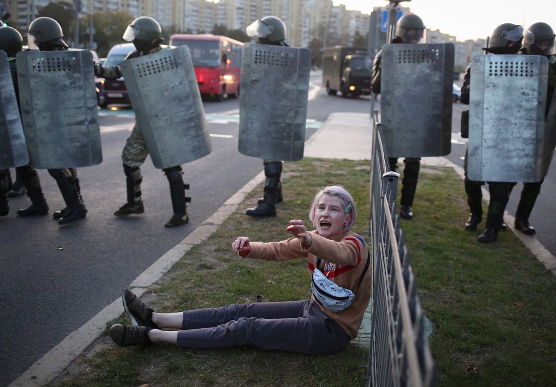 A woman reacts near police during a rally in Minsk, Belarus, on Wednesday, September 23.