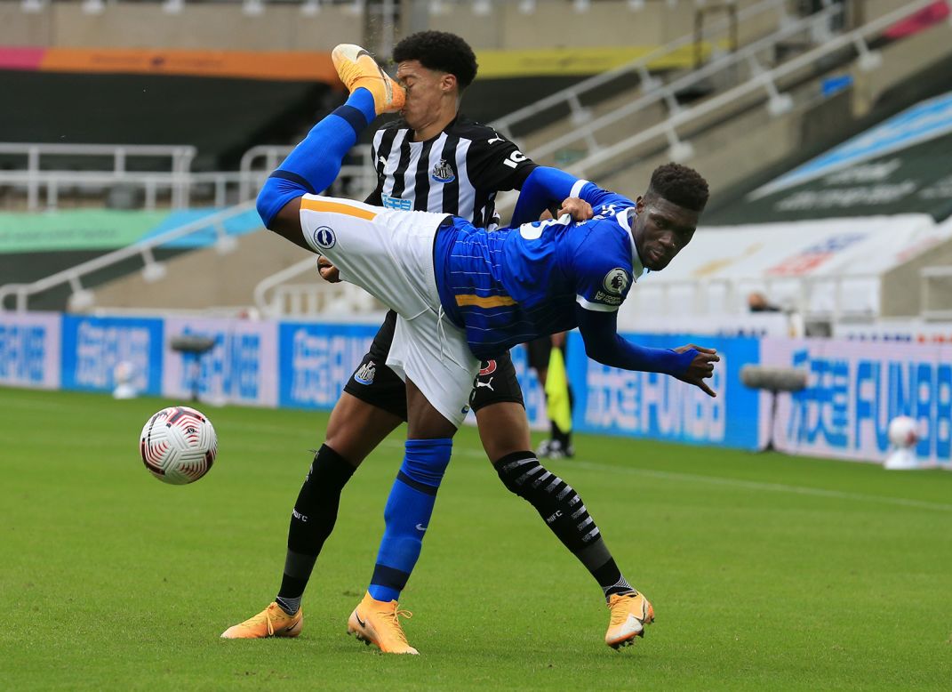 Jamal Lewis of Newcastle United is kicked in the face by Yves Bissouma of Brighton & Hove Albion during the Premier League match at St. James Park on Sunday, September 20, in Newcastle upon Tyne, England.