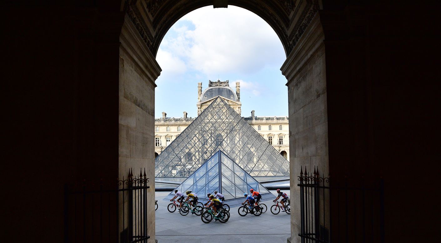 Cyclists ride in front of the Louvre during the last stage of the 107th Tour de France on Sunday, September 20, in Paris.