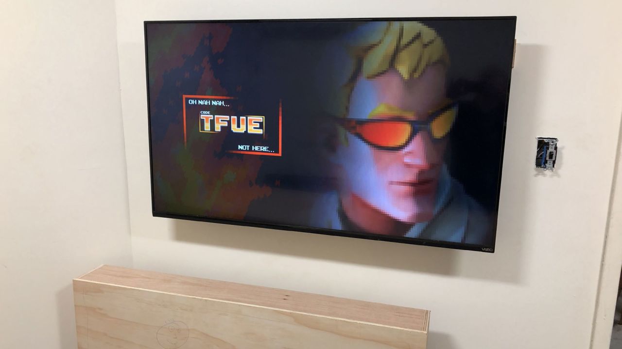 The wall-mounted flat screen TV found in the man cave was connected to a streaming device. A cabinet just below the TV appeared to be constructed to conceal the television, according to the MTA.