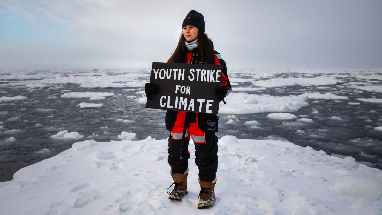 Environmental activist and campaigner Mya-Rose Craig, 18, protests on an ice floe in the Arctic. 
