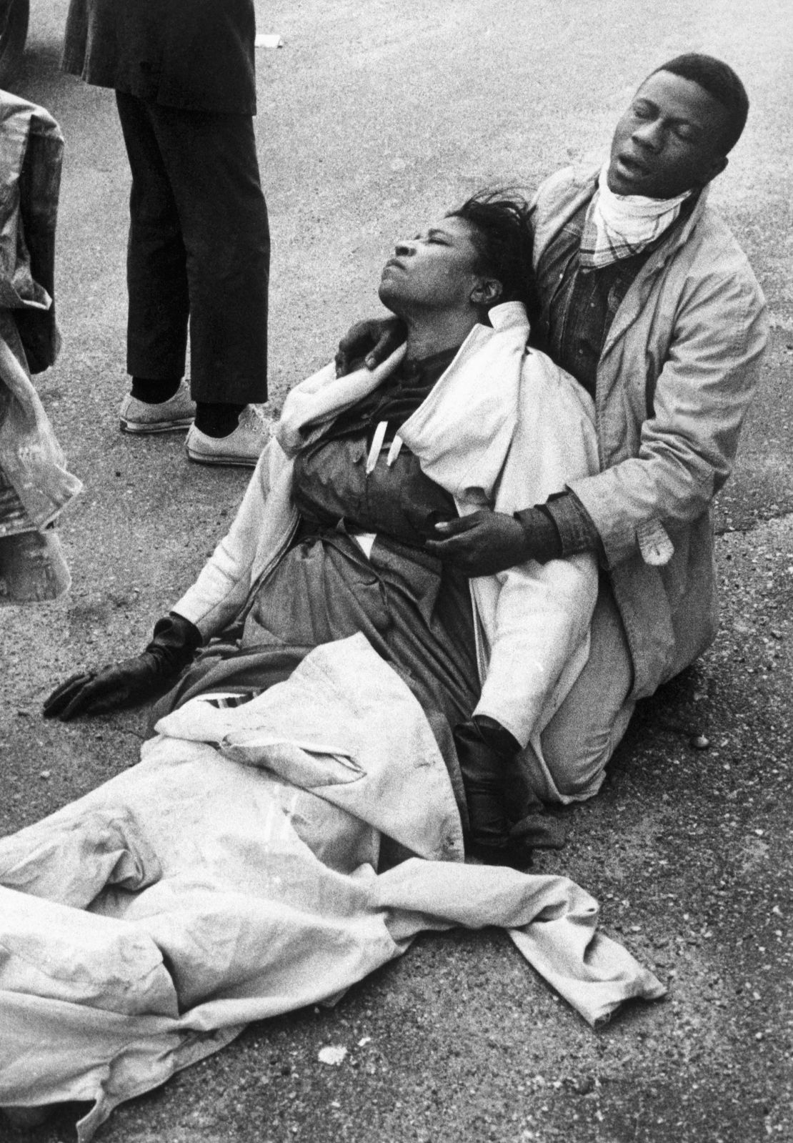 A civil rights marcher, suffering from exposure to tear gas, holds an unconscious Amelia Boynton after the police attacked marchers in Selma, Alabama, on March 7, 1965.