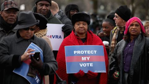 Alabama residents stand in line outside the US Supreme Court for the chance to hear oral arguments in Shelby County v. Holder on February 27, 2013, in Washington. 