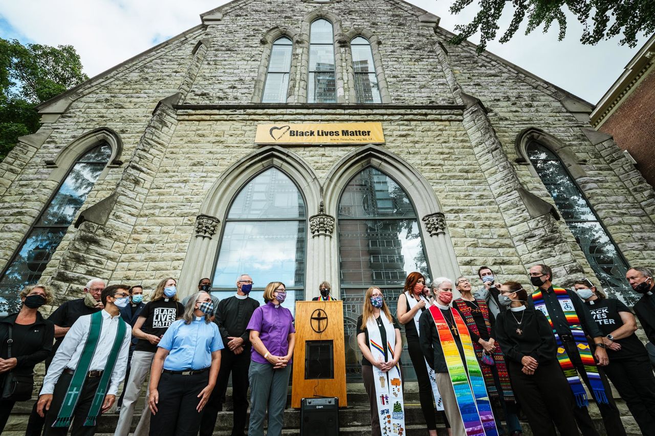 Religious leaders from around the city gather at a press conference in front of First Unitarian Church in Louisville on Friday, September 25. Leaders discussed the unrest and incident the previous night where police surrounded the church and threatened to detain anyone who attempted to exit the perimeter.