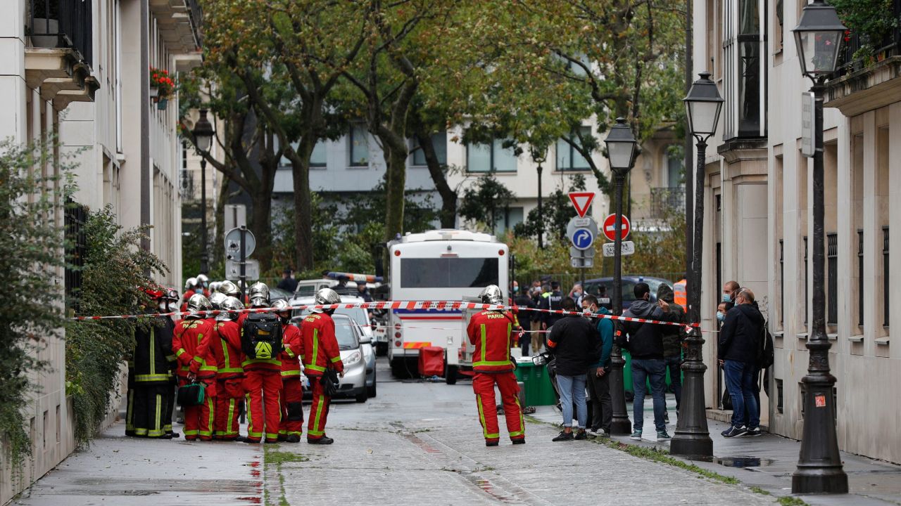 French firefighters are pictured near the scene of a knife attack in Paris on September 25.