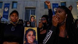 WASHINGTON, DC - SEPTEMBER 23:Demonstrators gather at the U.S. Department of Justice before marching to the White House in a call for justice for Breonna Taylor, who was killed by a member of the Louisville Police Department during a middle-of-the-night raid of Taylor's apartment, in Washington, DC, on Wednesday, September 23, 2020.  The actions of the officer who killed Taylor has been ruled justified while another of the three officers was indicted on a warrant endangerment charge.(Photo by Jahi Chikwendiu/The Washington Post via Getty Images)