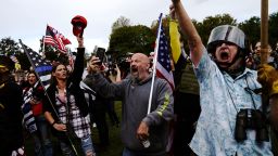 Members of the Proud Boys and other right-wing demonstrators rally on Saturday, Sept. 26, 2020, in Portland, Ore. (AP Photo/John Locher)