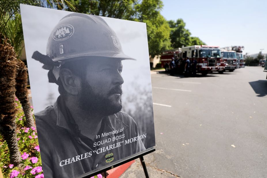 A photograph of Charles Morton, a firefighter killed battling the El Dorado Fire, is displayed at a memorial service in San Bernardino, California, on September 25, 2020. Morton, 39, was a 14-year veteran of the US Forest Service and a squad boss with the Big Bear Hotshot Crew of the San Bernardino National Forest.