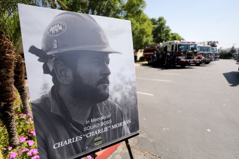 A photograph of Charles Morton, a firefighter killed battling the El Dorado Fire, is displayed at a memorial service in San Bernardino, California, on September 25. Morton, 39, was a 14-year veteran of the US Forest Service and a squad boss with the Big Bear Hotshot Crew of the San Bernardino National Forest.