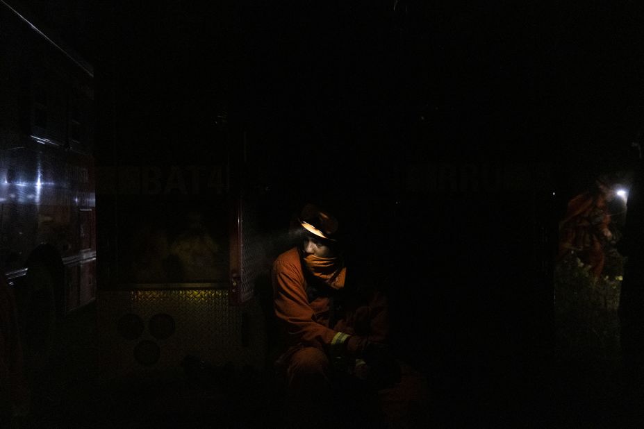 An inmate firefighter takes a break while working to contain the Bear Fire in Oroville, California, on September 24, 2020.