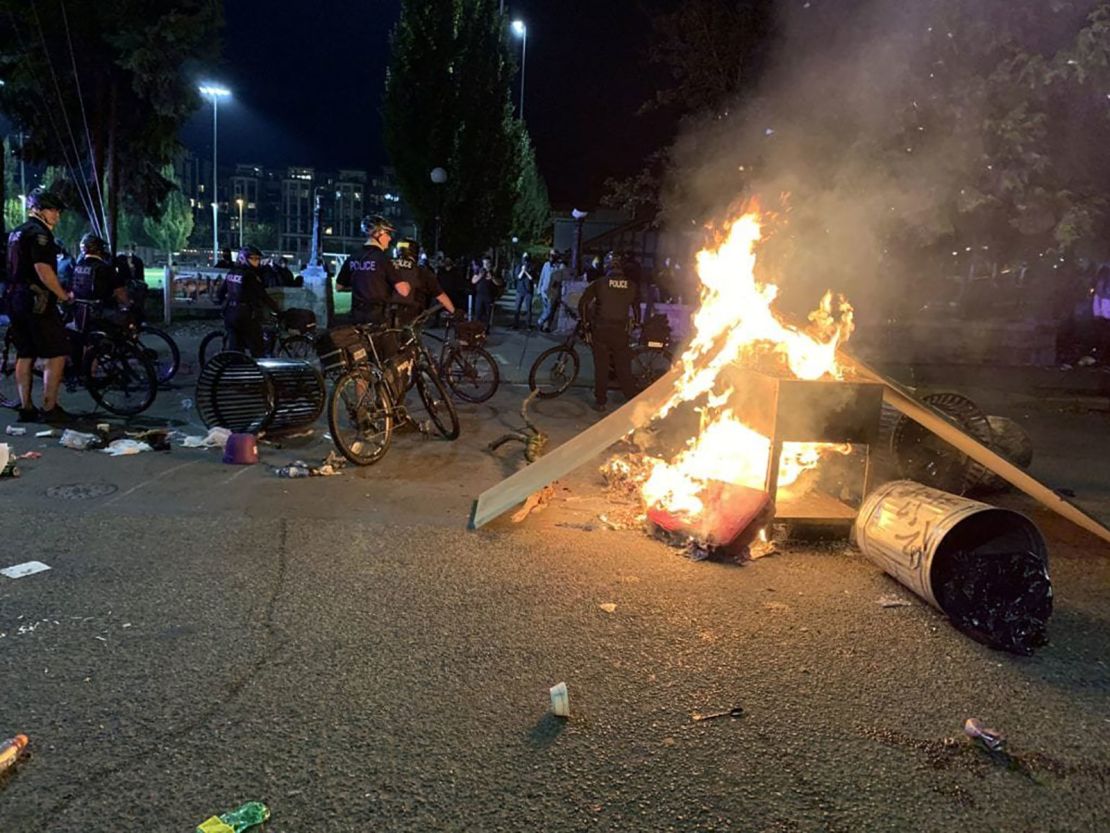 Police had to push back crowds so firefighters could douse blazes set around the city.