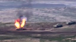 In this image taken from a footage released by Armenian Defense Ministry on Sunday, Sept. 27, 2020, Armenian forces destroy Azerbaijani tank at the contact line of the self-proclaimed Republic of Nagorno-Karabakh, Azerbaijan. Fighting between Armenia and Azerbaijan has broken out around the separatist region of Nagorno-Karabakh and the Armenian Defense Ministry says two Azerbaijani helicopters have been shot down. Ministry spokeswoman Shushan Stepanyan also said Armenian forces hit three Azerbaijani tanks.