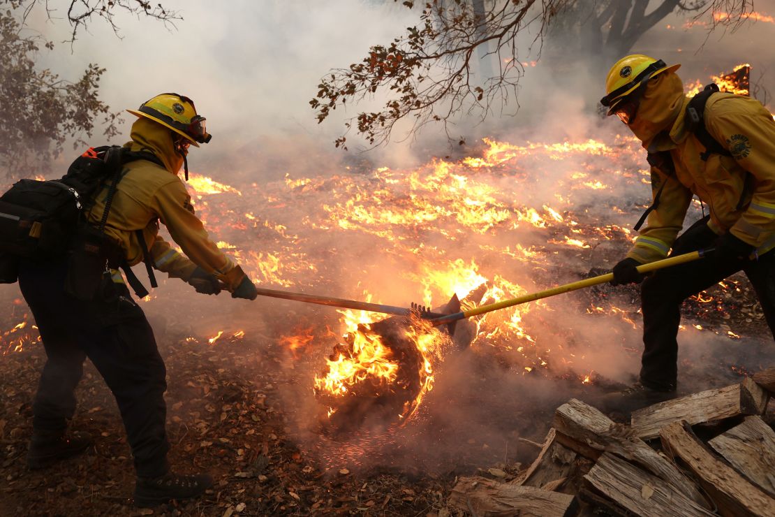 Marin County firefighters battle the Glass Fire on Sunday, September 27, in Calistoga, California.