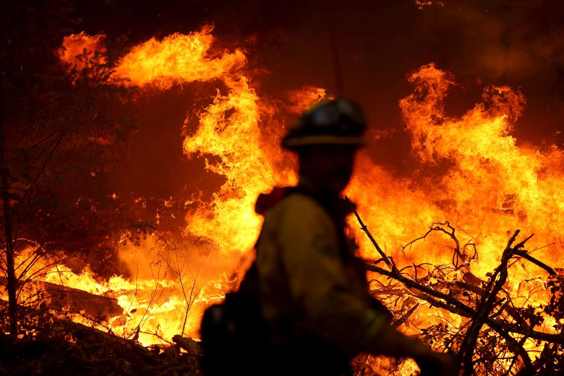 A Marin County firefighter battles the Glass Fire on Sunday, September 27, in Calistoga, California.