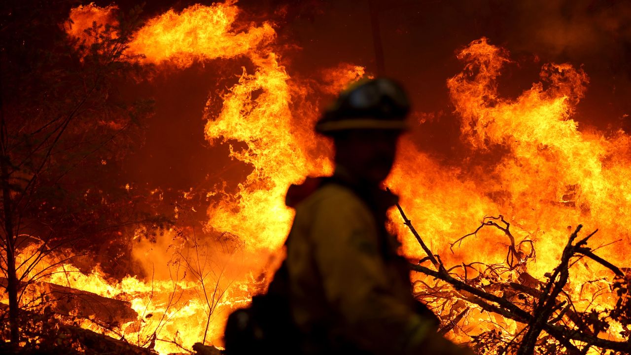 A Marin County firefighter battles the Glass Fire on Sunday, September 27, in Calistoga, California.