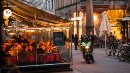 People dine in a restaurant on March 27, 2020 in Stockholm during the the new coronavirus COVID-19 pamdemic. - Sweden, which has stayed open for business with a softer approach to curbing the COVID-19 spread than most of Europe, on Friday limited gatherings to 50 people, down from 500. (Photo by Jonathan NACKSTRAND / AFP) (Photo by JONATHAN NACKSTRAND/AFP via Getty Images)
