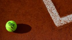 The 2020 French Open tennis tournament official ball is pictured on the tennis court during The Roland Garros 2020 French Open tennis tournament in Paris on September 26, 2020. (Photo by Martin BUREAU / AFP) (Photo by MARTIN BUREAU/AFP via Getty Images)