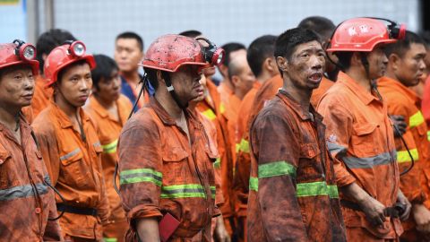 Rescuers wait outside the Songzao Coal Mine near Chongqing, in southwest China on September 27, 2020.