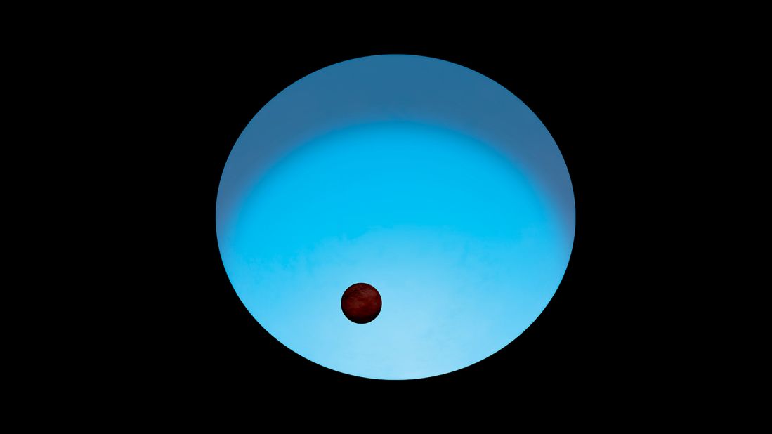 This is an artist's impression of exoplanet WASP-189 b orbiting its host star. The star appears to glow blue because it's more than 2,000 degrees hotter than our sun. The planet, which is slightly larger than Jupiter, has a tilted orbit around the star's poles rather than its equator.