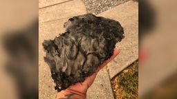 Santa Rosa resident Morgan Balaei tells CNN she has seen at least two large pieces of ash fall from the sky over her neighborhood in California. Balaei found this giant piece of ash outside of her home on September 27, 2020.