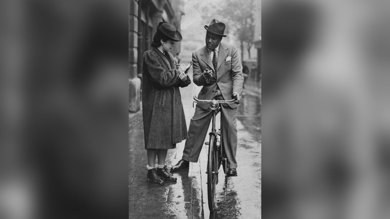 Hutchinson dictates a letter to his secretary before setting off on his bicycle, February 5, 1941.