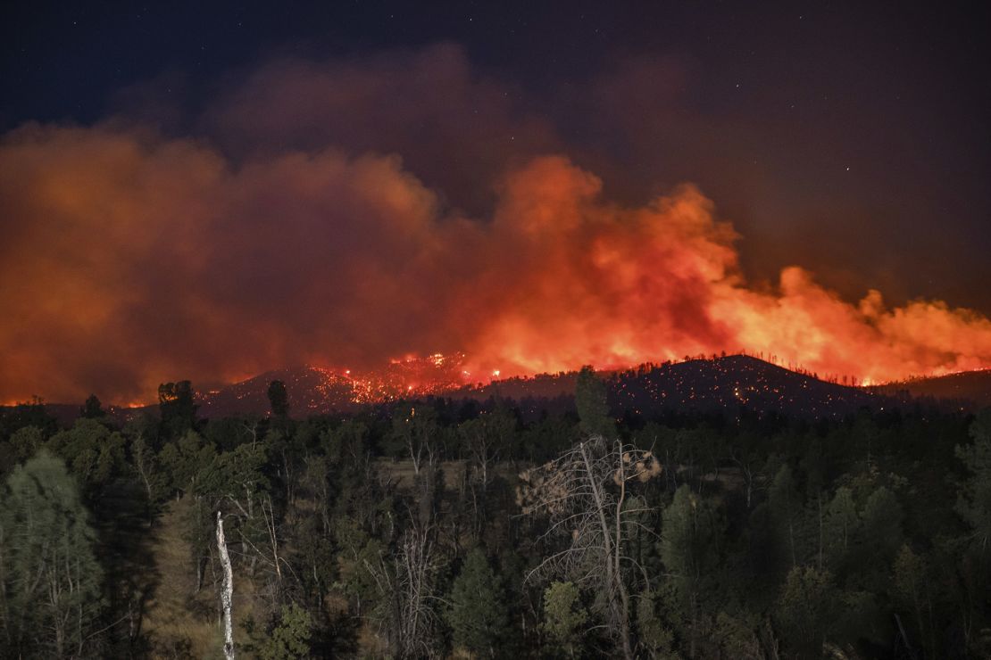 Flames are visible from the Zogg Fire near Igo, California.