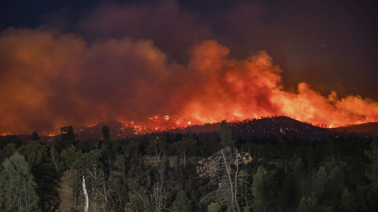 Flames are visible from the Zogg Fire near Igo, California.