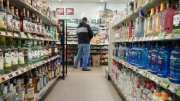 WESTBROOK, ME - APRIL 22: A customer gets rung out at Friendly Discount liquor store in Westbrook on Wednesday, April 22, 2020. According to the state, liquor sales in Maine increased by 16 percent in March and April. (Staff Photo by Gregory Rec/Portland Press Herald via Getty Images)