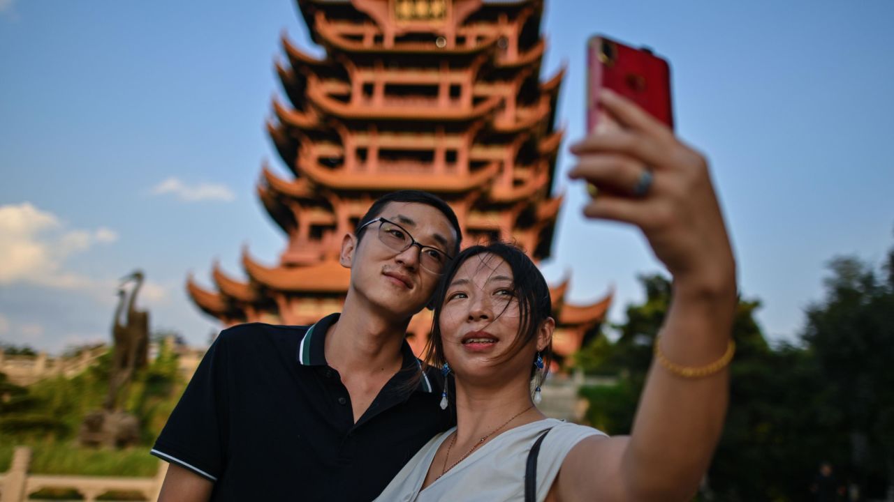 Tourists take a selfie at the the Yellow Crane Tower in Wuhan in September.