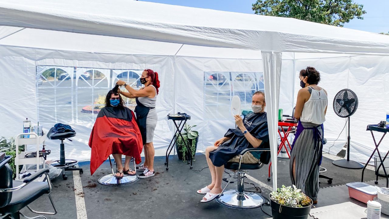 Denise Russell's salon in San Jose, California, initially reopened outside.